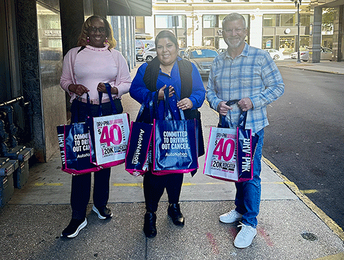 Flagship Associates with tote bags of comfort items for non-profits